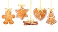 Christmas gingerbread cookies and cinnamon sticks hanging border on a white background. Royalty Free Stock Photo