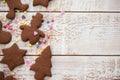 Christmas gingerbread cookies with different shapes over a white vintage wooden table Royalty Free Stock Photo