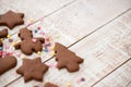 Christmas gingerbread cookies with different shapes over a white vintage wooden table Royalty Free Stock Photo