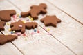 Christmas gingerbread cookies with different shapes over a white vintage wooden table Royalty Free Stock Photo