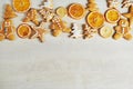Christmas gingerbread cookies and dried orange and spices on white table Royalty Free Stock Photo