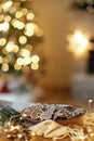 Christmas gingerbread cookies with icing in plate on festive rustic table with decorations against golden illumination. Merry Royalty Free Stock Photo