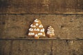 Christmas gingerbread cookies on rustic wooden table flat lay with space for text. Christmas trees gingerbread cookies. Season`s Royalty Free Stock Photo