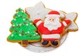 Christmas Gingerbread colored cookies in the shape of stars, Santa Claus, Christmas tree on a white plate Royalty Free Stock Photo