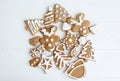 Tasty homemade gingerbread reindeer, tree, star and hearts cookies with icing