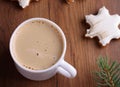 Christmas gingerbread cookies on a wooden background with aromatic coffee and cinnamon sticks Royalty Free Stock Photo