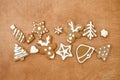 Christmas gingerbread cookies on wooden background, flat lay