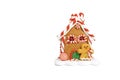 Christmas gingerbread house with gingerbread man on white background isolate Royalty Free Stock Photo