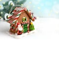 Christmas gingerbread house over fir tree on white background. Royalty Free Stock Photo