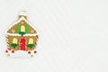 Christmas gingerbread house on white chevron textured fabric background