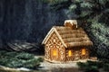 Christmas Gingerbread House with Window Lights in Winter Snowy Forest Night. Creative Food Decoration Design for Xmas Holiday Royalty Free Stock Photo