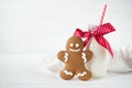 Christmas gingerbread man and bottle of milk with straw, white wooden background Royalty Free Stock Photo