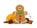 Christmas gingerbread man with holiday spices over white Royalty Free Stock Photo