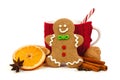Christmas gingerbread man with mug and holiday spices over white Royalty Free Stock Photo
