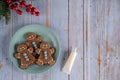 Christmas gingerbread men cookies on a blue plate Royalty Free Stock Photo