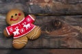 Christmas gingerbread men on wooden background. Royalty Free Stock Photo