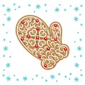 Christmas gingerbread in the shape of a mitten with a pattern of white glaze. Ginger Cookie. Confectionery, delicious