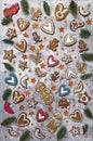 Christmas gingerbread, spices and decorations with fir tree branches Royalty Free Stock Photo