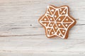 Christmas gingerbread star on wooden background Royalty Free Stock Photo