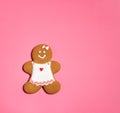 Christmas Gingerbread woman Cookie on a pink background