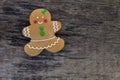 Christmas gingerbread woman on rustic wooden table