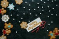 Christmas gingerbreads, marshmallows and greeting card Royalty Free Stock Photo