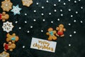 Christmas gingerbreads, marshmallows and greeting card Royalty Free Stock Photo