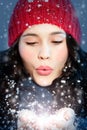 Christmas girl blowing snow in hands Royalty Free Stock Photo