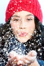 Christmas girl blowing snow in hands Royalty Free Stock Photo