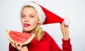 Christmas girl eat watermelon. Exotic winter holiday. Celebrate new year summer. Girl wear santa hat eat slice