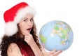 Christmas girl with globe Royalty Free Stock Photo