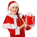 Christmas girl holding gift wearing Santa costume. Royalty Free Stock Photo