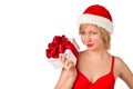 Christmas girl holding gift wearing Santa hat Royalty Free Stock Photo