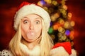 Christmas girl made bubble bubblegum. Crazy grimace. Blow Bubbles with Gum. Only fun on my mind. Girl Santa claus making Royalty Free Stock Photo