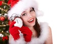 Christmas girl, santa hat, fir tree, alarm clock Royalty Free Stock Photo