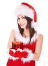 Christmas girl in santa hat holding red gift box. Royalty Free Stock Photo