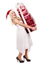 Christmas girl in santa hat holding red gift box. Royalty Free Stock Photo