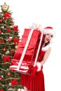 Christmas girl in santa hat and red gift box. Royalty Free Stock Photo