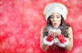 Christmas Girl.Winter woman Blowing Snow Royalty Free Stock Photo