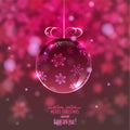 Christmas glass ball on blurred background with snowflakes, Royalty Free Stock Photo