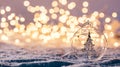 Christmas glass ball with tree in it on winter background.