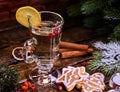 Christmas glass latte mug with lemon and red berry cookies . Royalty Free Stock Photo