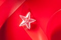 Christmas glass star on red ribbon Royalty Free Stock Photo