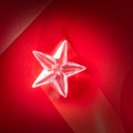 Christmas glass star on red ribbon Royalty Free Stock Photo