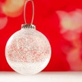 Christmas glass transparent bauble on snow