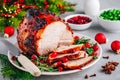 Christmas Glazed Ham with cranberry sauce. Roasted Holiday Pork Meat Royalty Free Stock Photo