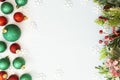 Christmas glitered green and red baubles, balls isolated on snow. Winter abstract border mockup Royalty Free Stock Photo