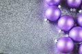 Christmas Glitter Background with Purple Baubles Royalty Free Stock Photo