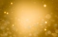 Christmas glowing Golden Background. Christmas lights. Gold Holiday New year Abstract Glitter Defocused Background With Blinking Royalty Free Stock Photo