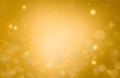 Christmas glowing Golden Background. Christmas lights. Gold Holiday New year Abstract Glitter Defocused Background With Blinking Royalty Free Stock Photo